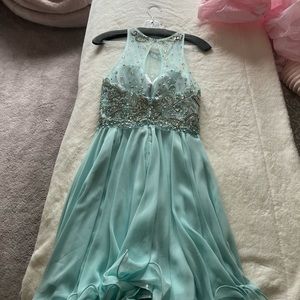 Beautiful light blue dress with crystal detailings and gems.